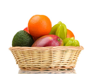 Assortment of exotic fruits in basket isolated on white