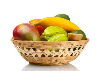 Assortment of exotic fruits in basket isolated on white