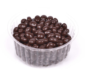 Dark brown dragee, chocolate covered nuts