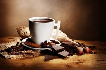  cup of hot chocolate, cinnamon sticks, nuts and chocolate © Africa Studio