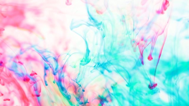 bright colors swirling and mixing in water