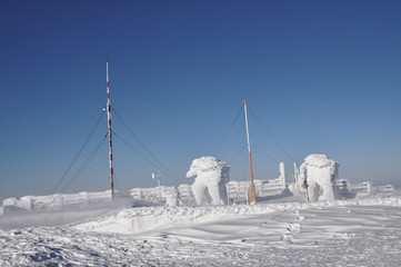 An ice-covered meteorological station, high on a mountain-top