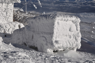 Snow covered, frozen car at winter