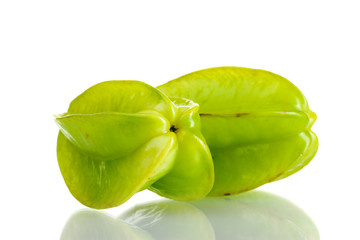two fresh carambola fruits isolated on white