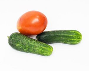 red tomato and cucumber together on a white background