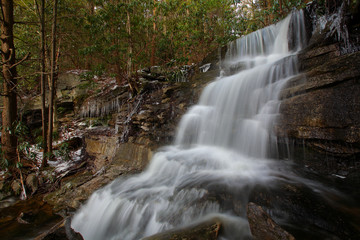 Beautiful waterfalls in the mountains in winter