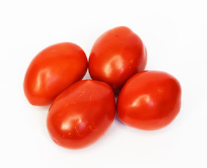 Four ripe tomatoes isolated on white background
