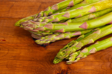 delicious asparagus on wooden background