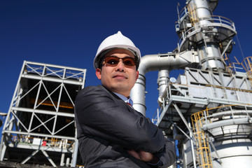 potret businessman with chemical plant background