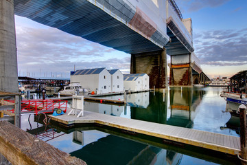 Water homes under the bridge in Tacoma downtown.