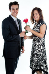 man gives a woman flowers