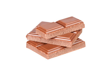 Chocolate pieces on the white background