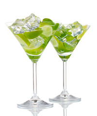 glasses of cocktail with lime and mint isolated on white