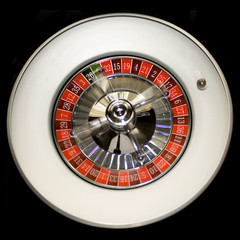 Ball is rolling on a roulette wheel
