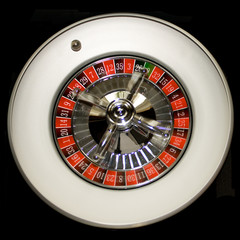 Ball is rolling on a roulette wheel
