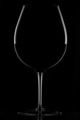 red wine in glass on black
