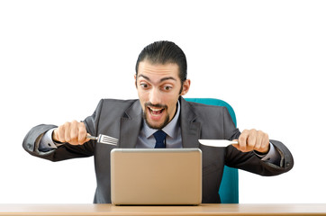 Man eating his laptop - stupid concept