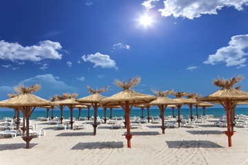 Empty beach and beach umbrellas