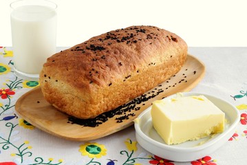 loaf of bread,butter and milk