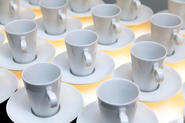 Many white coffee mugs