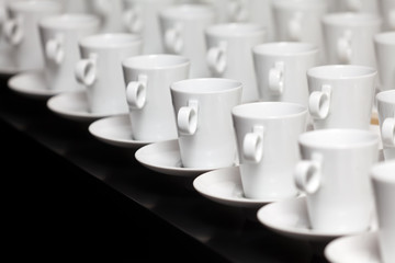 Many white coffee mugs