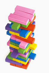 Bright wooden cubes are combined by a high tower,heap