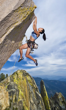 Rock climber dangling.