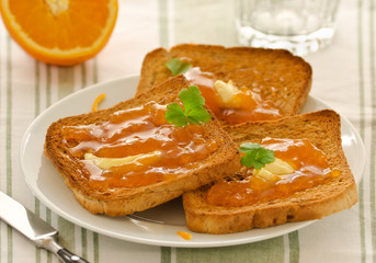 Toasts with apricot jam and butter