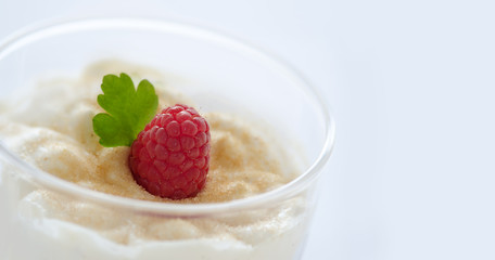 Ice cream garnished with raspberry