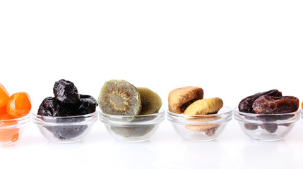 Dried fruits in bowls isolated on white
