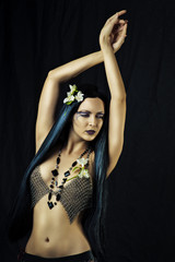 Young sexy woman dancing belly dance