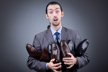Man with a selection of shoes