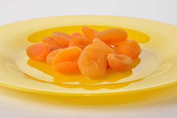 Dried apricotes on plate