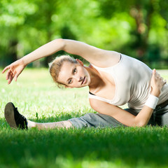 Young woman doing yoga exercise