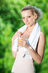 Woman drinking juice after exercise