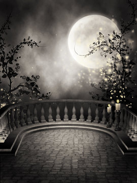 Gotycki balkon ze świecami i księżycem