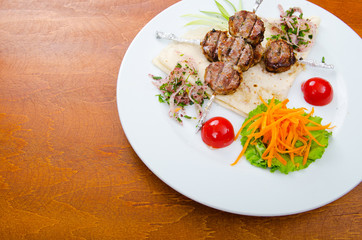 Meat cuisine - kebab served in plate