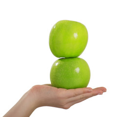 two green apples on hand isolated