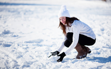 Girl playing with snow