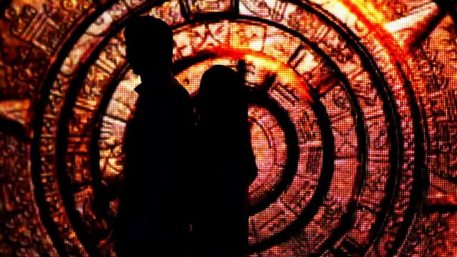 silhouette couple who had their backs to each other in tunnel