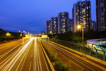 Fototapeta na wymiar car light trails in modern city