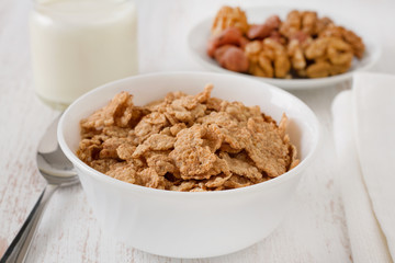cereals with nuts and glass of milk