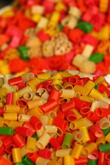 Multicolored pasta in traditional market in India.