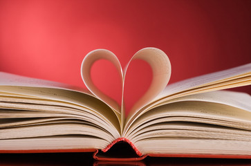 pages of a book curved into a heart shape