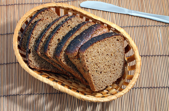 Cut black bread with caraway seeds