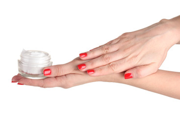 Female hands with manicure holding cream isolated on white