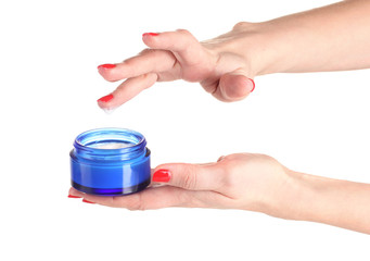 Female hands with manicure holding cream isolated on white