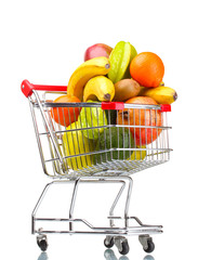 Assortment of exotic fruits  in shopping cart isolated on white