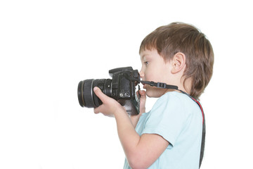 young boy taking picture over white