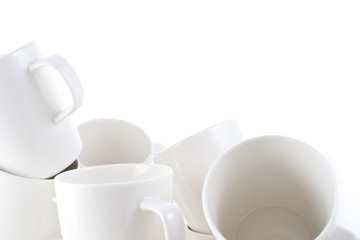 Many stacked of white cups